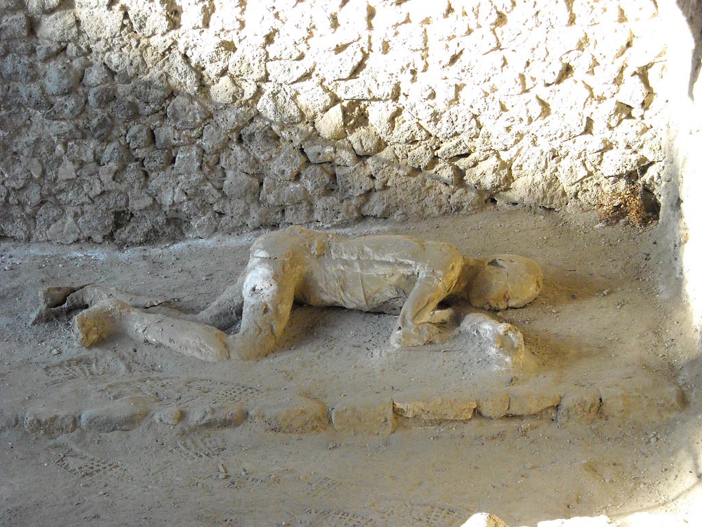Victim 31. Pompeii, outside Porta Nocera. Plaster cast of remains of a second fleeing victim found 16th March 1957. 