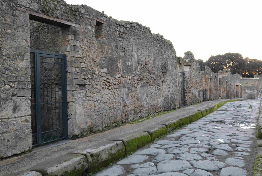 I.3.24 Pompeii. December 2018. Looking west along Vicolo del Menandro from outside entrance doorway. on left. Photo courtesy of Aude Durand.