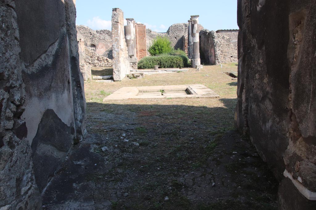 VI.9.3 Pompeii. October 2022. 
Looking east from entrance corridor/fauces (1), across atrium (4) towards tablinum (6). Photo courtesy of Klaus Heese.
