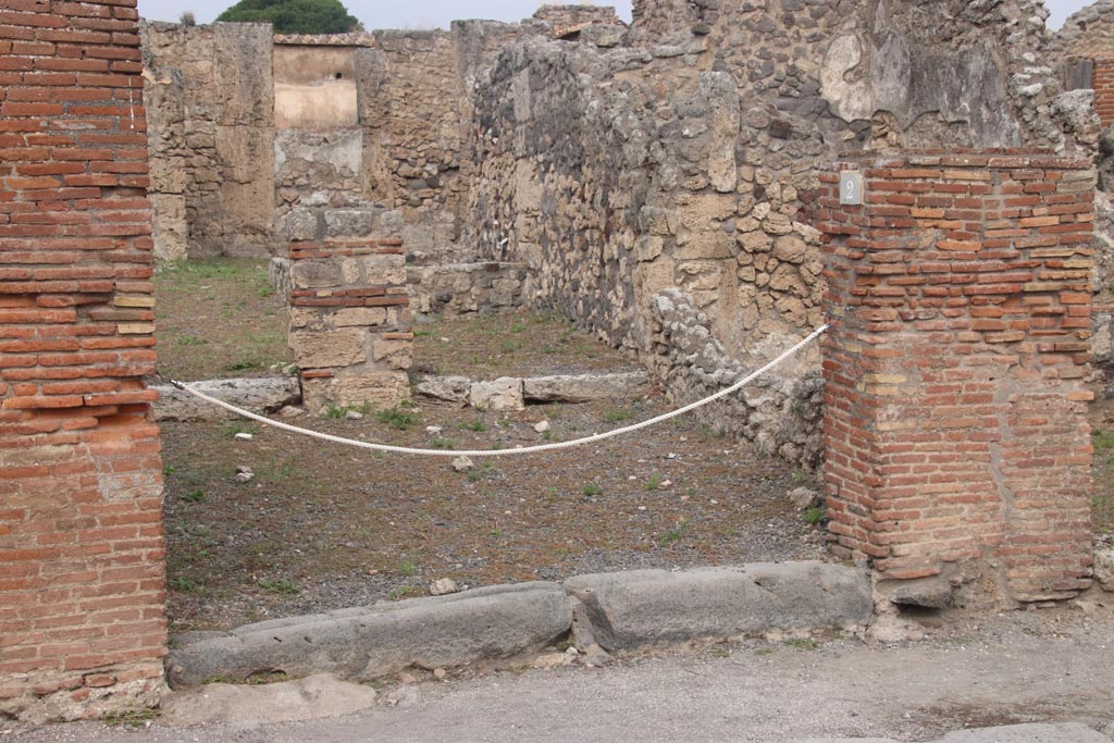 VI.14.2 Pompeii. October 2023. Looking north towards entrance doorway to shop-room. Photo courtesy of Klaus Heese.
