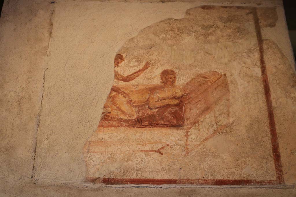 VII.12.18 Pompeii. December 2018. Remains of painted erotic wall fresco on frieze. Photo courtesy of Aude Durand.