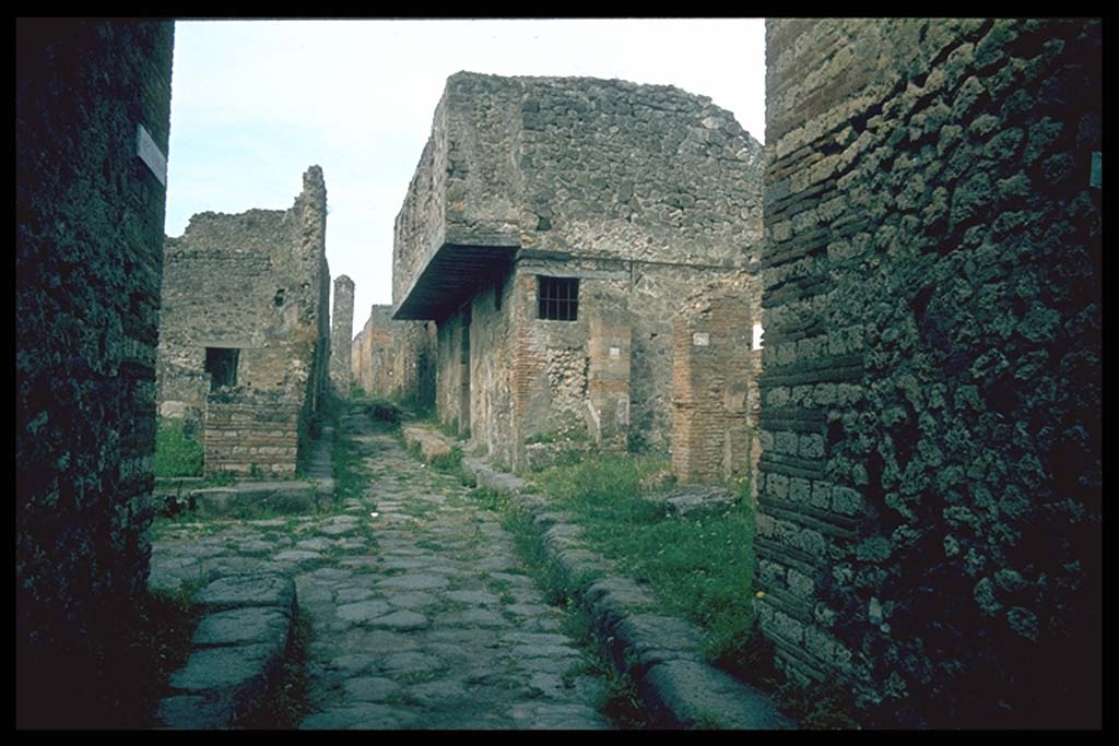 VII.12.28 Pompeii. Looking west to the junction of Vicolo del Balcone Pensile with Vicolo della Maschera, on the left. 
Photographed 1970-79 by Günther Einhorn, picture courtesy of his son Ralf Einhorn.
