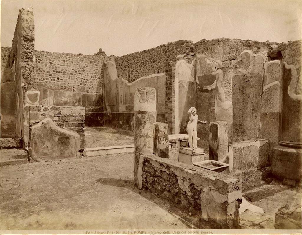 VII.12.28 Pompeii. Looking from west portico towards north portico and white marble threshold of the exedra, with painted decoration.
Fratelli Alinari 11345a, Public domain, via Wikimedia Commons
