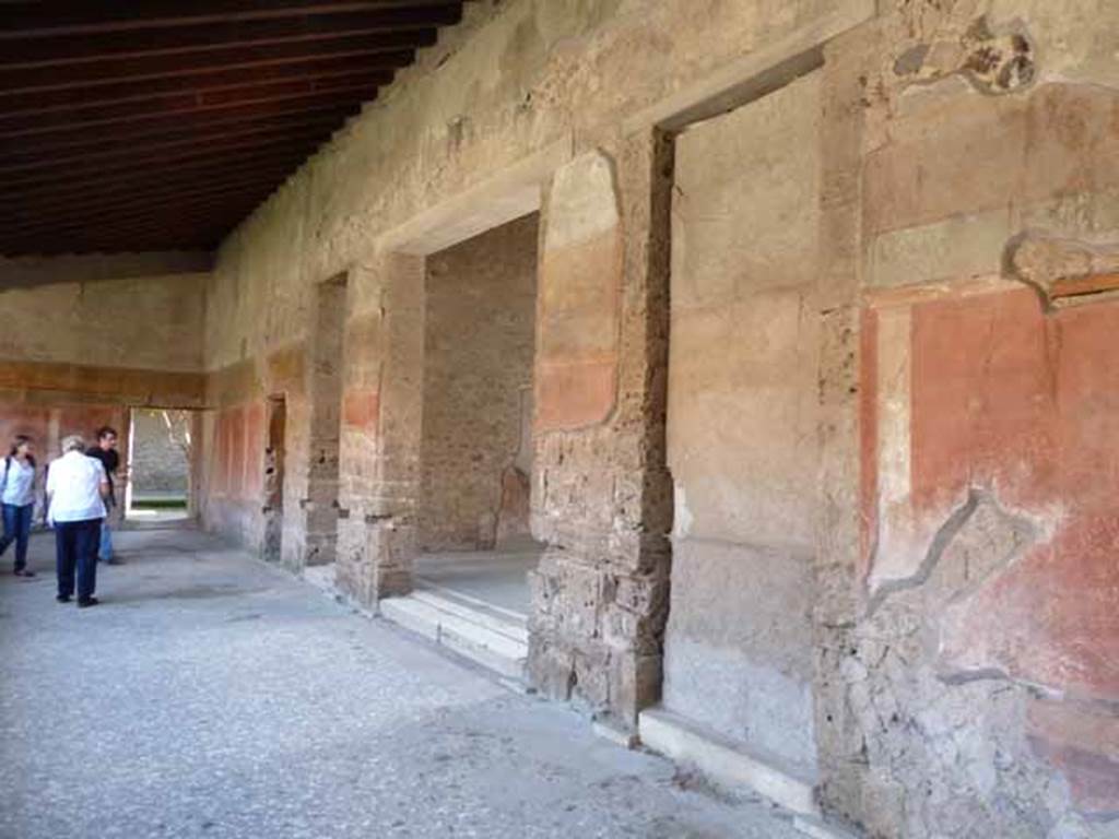 Villa of Mysteries, Pompeii. May 2010. Peristyle A, looking south to blocked door to atrium, and doorway to room 64, the atrium.
