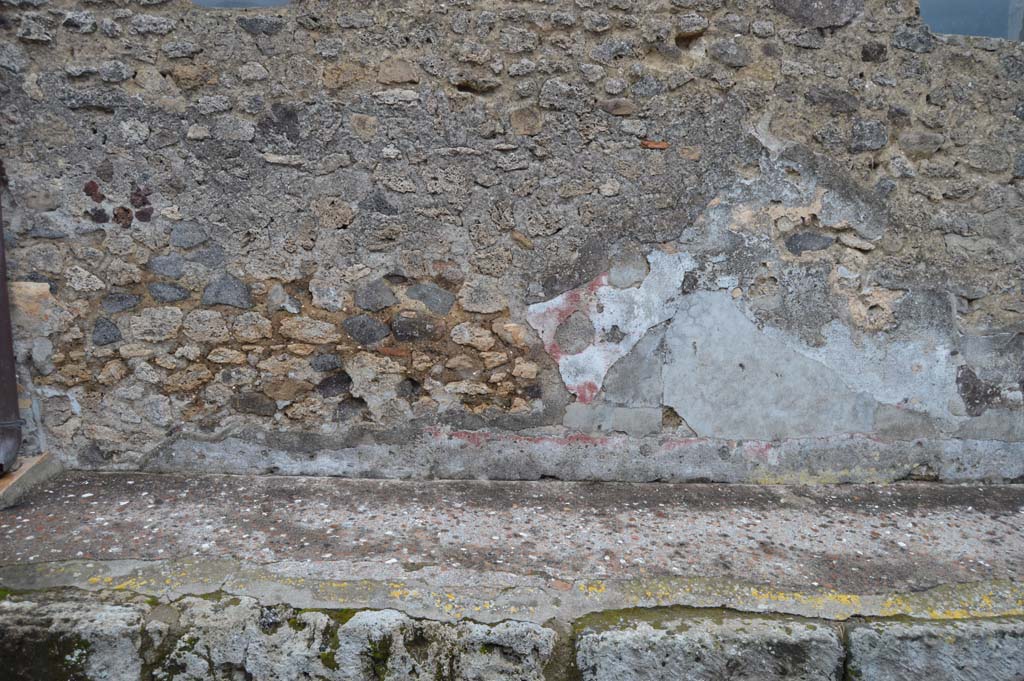 Vicolo della Fullonica, Pompeii. March 2018. Looking east, detail of remaining decoration on lower wall of VI.8.3. 
Foto Taylor Lauritsen, ERC Grant 681269 DÉCOR.
