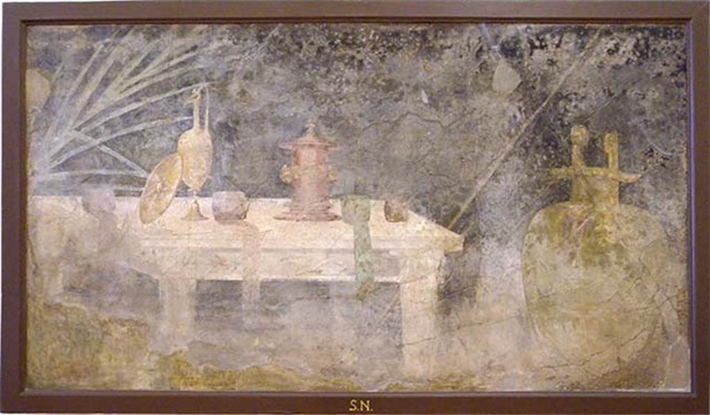 Villa of P Fannius Synistor at Boscoreale. Peristyle E, south wall, west end. Wall painting of marble table with athletic prizes. Now in Naples Archaeological Museum.  Inventory number s.n.6.