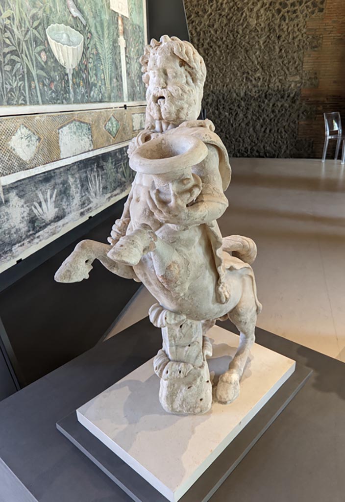 Oplontis Villa of Poppea, April 2022. 
Statuette of Centaur holding a club and a crater. Photo courtesy of Giuseppe Ciaramella.
