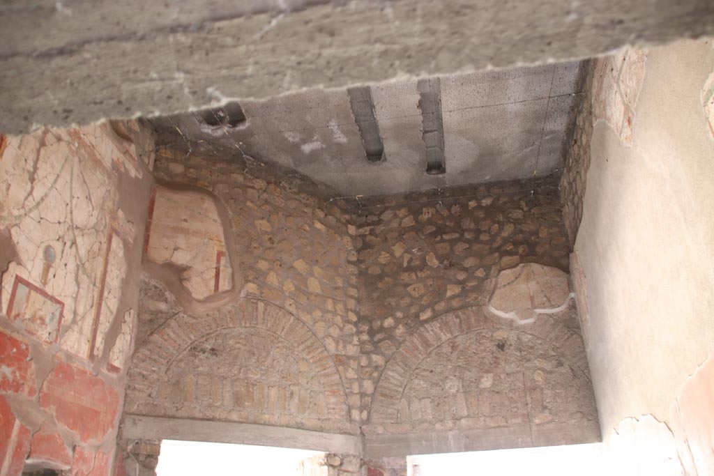 Oplontis Villa of Poppea, October 2022.  
Room 79, looking towards east wall above doorways to room 78, on left, and to room 85, on right. Photo courtesy of Klaus Heese.
