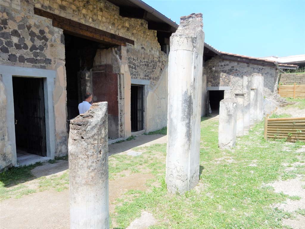 Stabiae, Villa Arianna, June 2019. W.22, north courtyard, looking towards large atrium doorway with painted decoration.
Photo courtesy of Buzz Ferebee.
