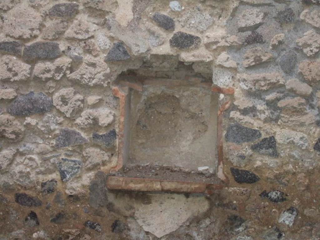 IX.2.5 Pompeii.  December 2005. Niche Lararium in north wall of garden.