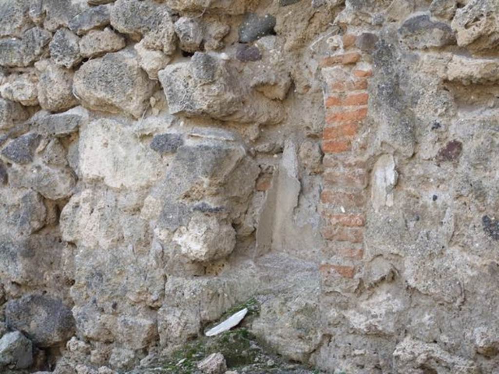 I.3.15 Pompeii. December 2007. Niche for household gods.
According to Boyce –
in the west wall to the right of the entrance above a masonry table was an arched niche (h.0.60, w.0.42, d.0.25, h. above table, 0.30).
Its walls covered with successive layers of stucco, variously painted red, blue and yellow.
He said Fiorelli referred to it as la nicchia dei Lari.
See Boyce G. K., 1937. Corpus of the Lararia of Pompeii. Rome: MAAR 14. (p.24, no.24). 


