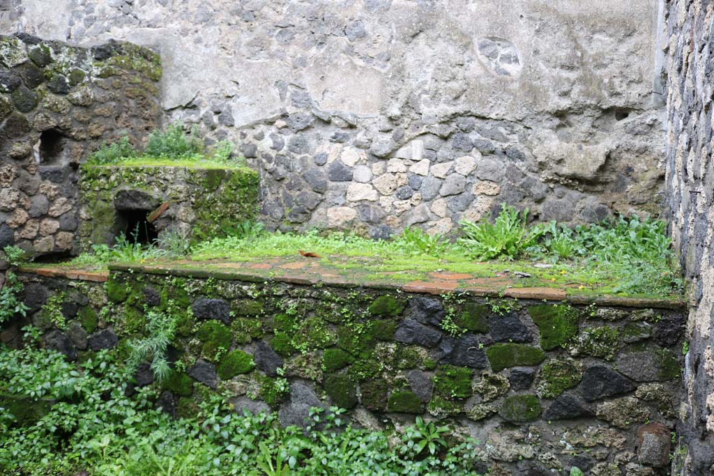 II.8.5 Pompeii. December 2018. Bench and hearth in second room on north side of corridor. Photo courtesy of Aude Durand.