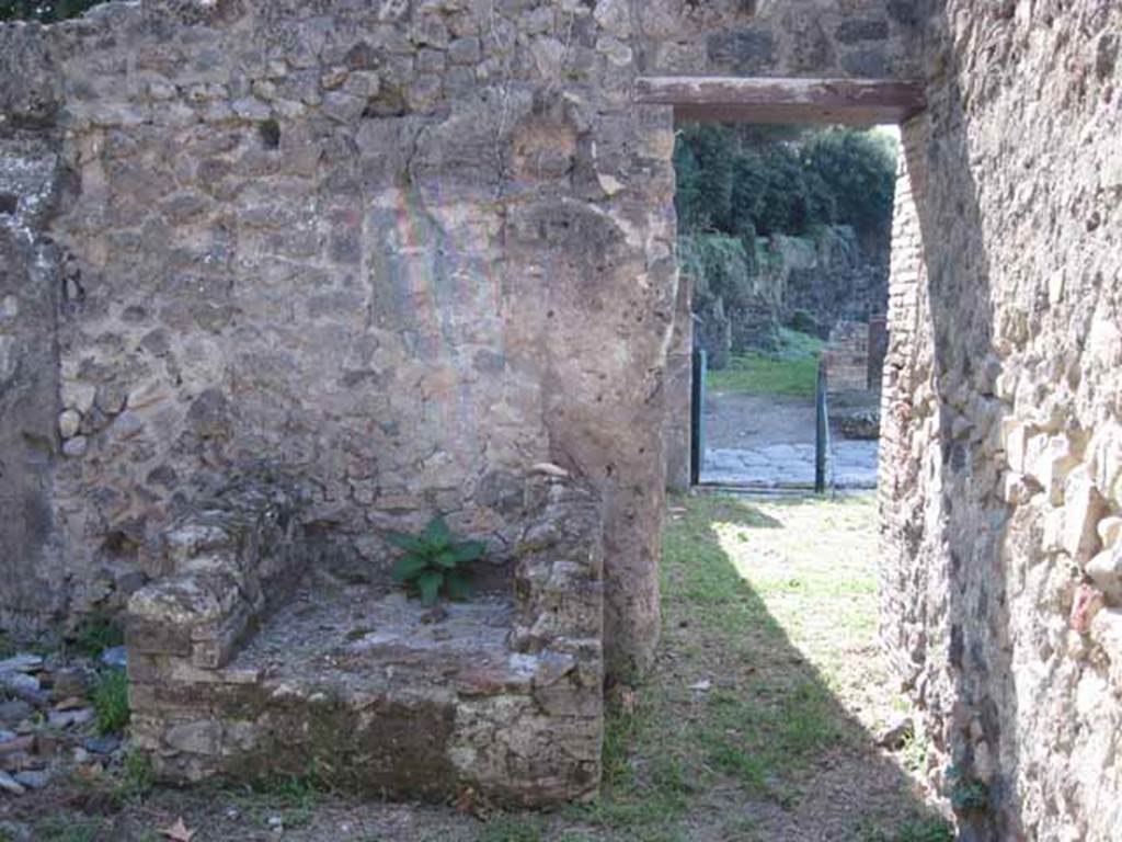 I.1.2 Pompeii. September 2010. Doorway from large room, looking west into bar-room. The hearth can be seen on the south side of the doorway.
Photo courtesy of Drew Baker.

