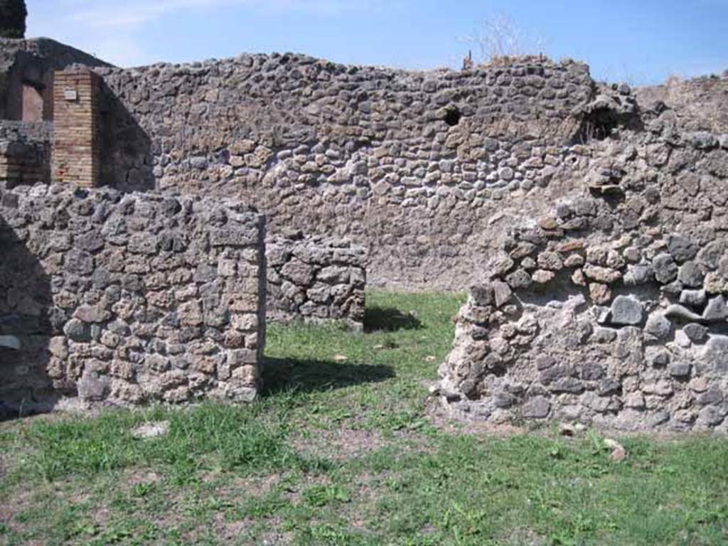 I.1.8 Pompeii. September 2010. North wall of entrance room, with doorway leading to I.1.9.
In the 2011 excavations led by Stephen Ellis they were able to recognise its precise location of the lararium.
It would have been on the wall to the right of the doorway in this photograph.
This conclusion was based on the sketches themselves more than on the earliest written descriptions. 
The altar appears in the sketch to have been three-dimensional, with a tile jutting out from the wall face upon which to place offerings.
Their analysis of the standing architecture revealed what may be the remnants of that tile.
On the southern face of the north wall in the entrance area, a heavily damaged tile projecting from the wall is preserved. On the top of this tile are traces of plaster, and mortar can be seen on its under-side – this served to level the tile within the uneven wall construction. 
If this was indeed the same tile as shown in the sketches, then we are able to place the shrine to the east of the southern door from I.1.8 to I.1.9, and thus on the northern wall of the entrance courtyard of I.1.8.
Here it would have been visible from the street.
See www.fastionline.org/docs/FOLDER-it-2012-262.pdf
Photo courtesy of Drew Baker.
