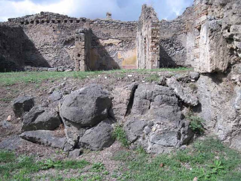 1.2.3 Pompeii. September 2010. Looking north in triclinium at site of north wall (and lava outcrop).  Photo courtesy of Drew Baker.
