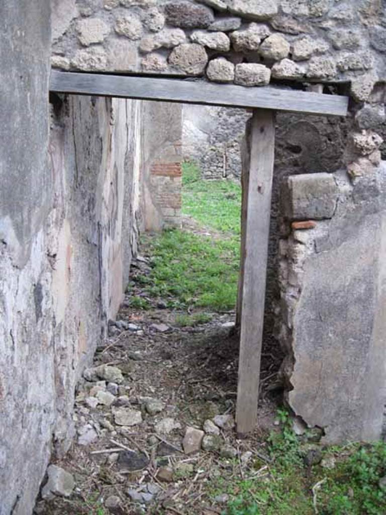 I.2.24 Pompeii. September 2010. Looking south through doorway into large room on north side of atrium. Photo courtesy of Drew Baker.
