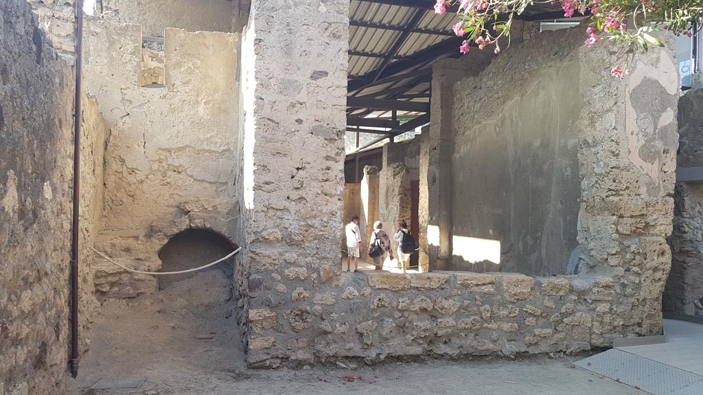 I.6.4 Pompeii. August 2023. 
Looking north towards room 14, stairs to upper floor, on left, and window into tablinum, on right. Photo courtesy of Maribel Velasco.
