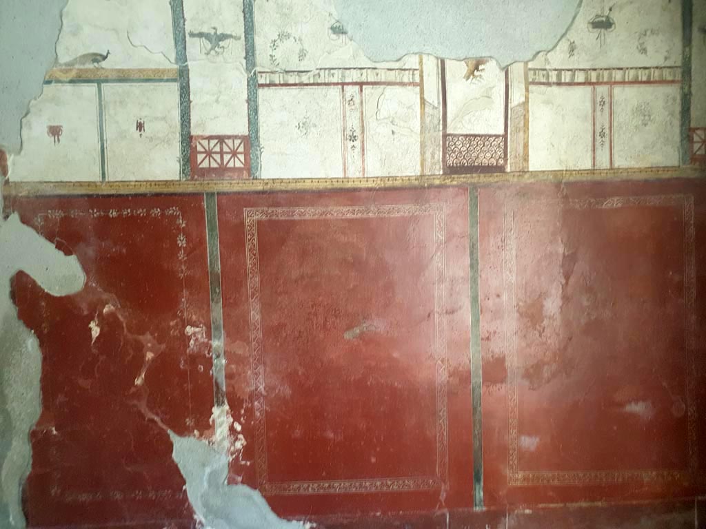 I.6.7 Pompeii. August 2023. Room to west of entrance, detail from west wall. Photo courtesy of Maribel Velasco.