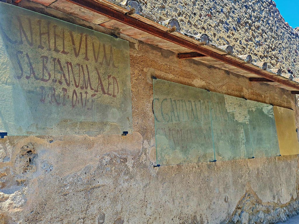 I.7.13 Pompeii. June 2024. Painted inscriptions found on south side of entrance doorway. Photo courtesy of Giuseppe Ciaramella.