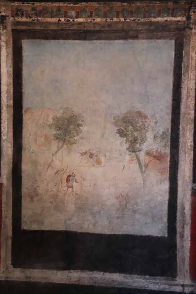 I.9.5 Pompeii. October 2022. 
Room 10, west wall of triclinium with central painting of Acteon and Artemis, or Diana. 
Photo courtesy of Klaus Heese.

