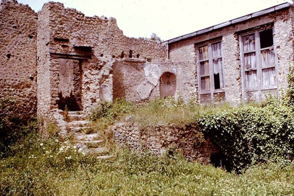 I.10.4 Pompeii. 1961. Looking north from lower garden area, to steps to corridor at rear of baths area.  Photo by Stanley A. Jashemski.
Source: The Wilhelmina and Stanley A. Jashemski archive in the University of Maryland Library, Special Collections (See collection page) and made available under the Creative Commons Attribution-Non Commercial License v.4. See Licence and use details.
J61f0352
