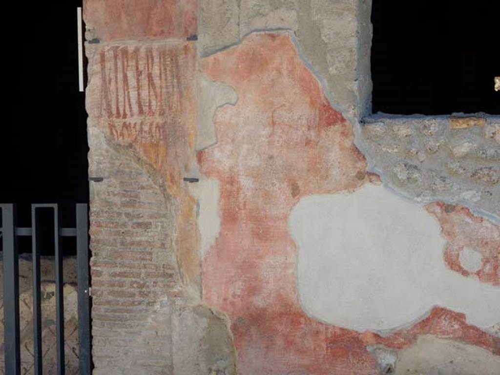 I.12.3 Pompeii, May 2018. Graffiti on the wall to west of door. Photo courtesy of Buzz Ferebee.