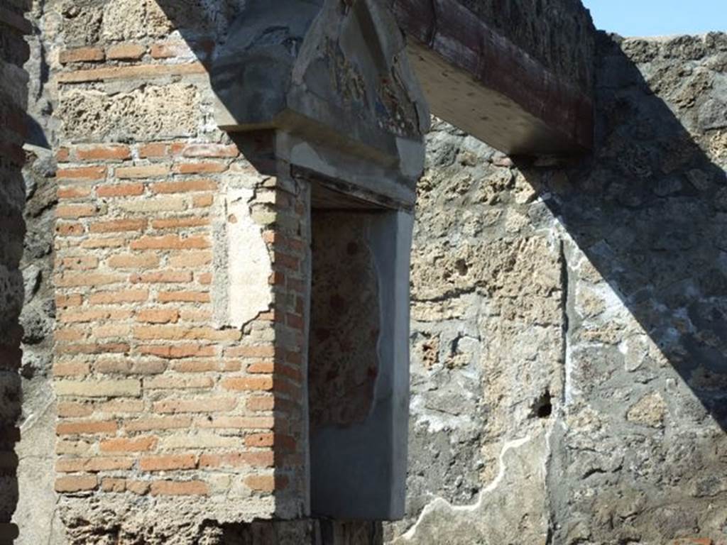 I.13.12 Pompeii. March 2009.  West wall of atrium, south of the Ala.  Aedicula Niche Lararium, with frescoed white walls. 