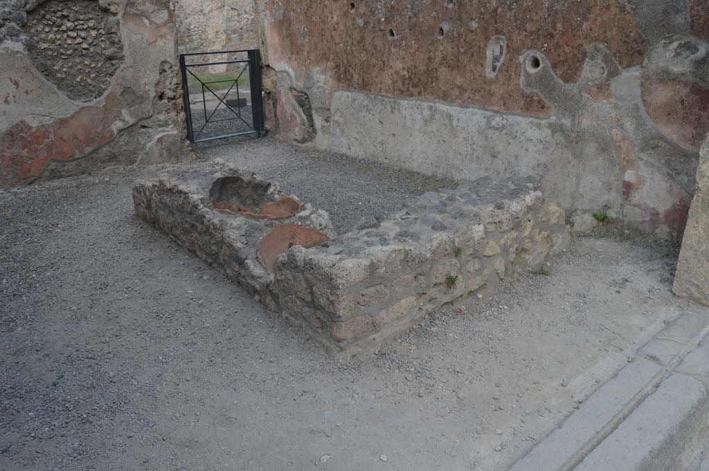 I.13.13 Pompeii. October 2017. 
Looking north-east across counter towards doorway in north wall leading into atrium of I.13.12.
Foto Taylor Lauritsen, ERC Grant 681269 DÉCOR.
