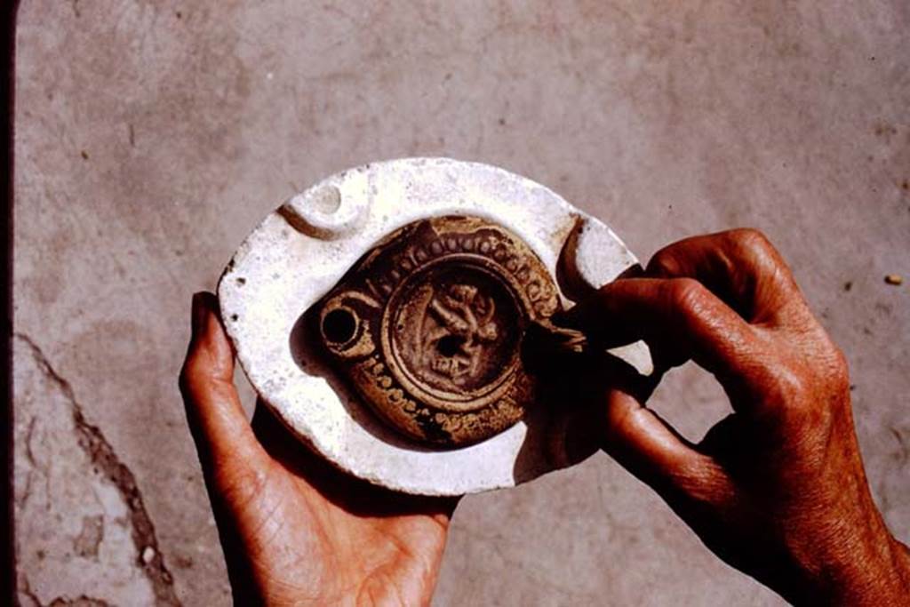 I.20.3 Pompeii. 1972. Example of lamp in a mould. Photo by Stanley A. Jashemski. 
Source: The Wilhelmina and Stanley A. Jashemski archive in the University of Maryland Library, Special Collections (See collection page) and made available under the Creative Commons Attribution-Non Commercial License v.4. See Licence and use details. J72f0115

