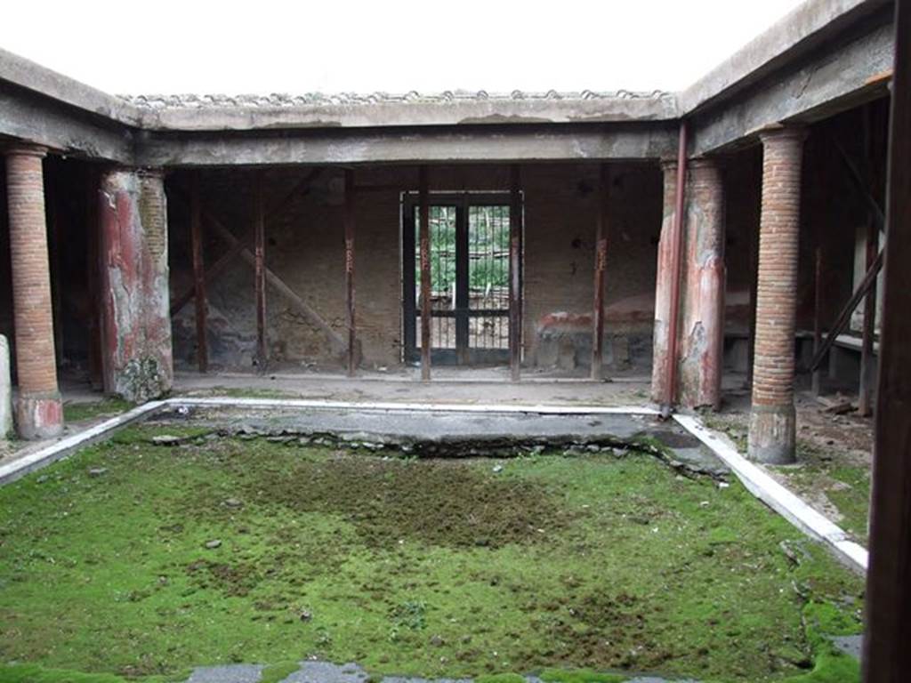 II.4.6 Pompeii. December 2006. From doorway of apodyterium, looking towards north portico, and entrance doorway. 