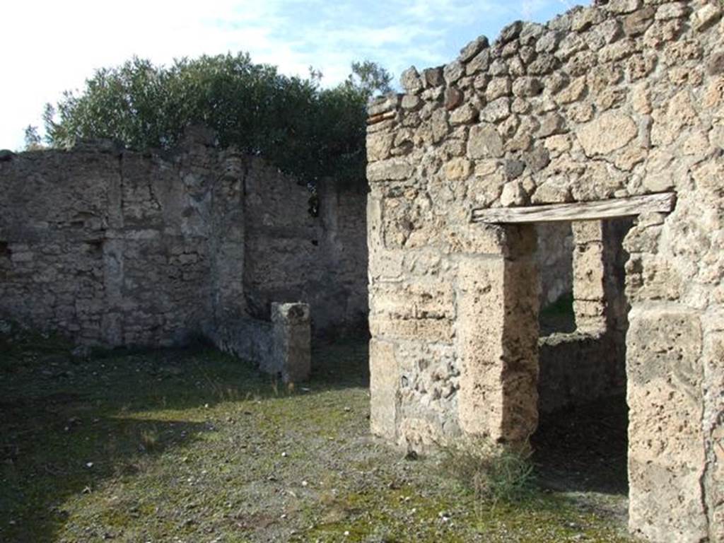 V.2.7 Pompeii. December 2007. Doorway to room 11 on right, and doorway to garden area 12, in centre.