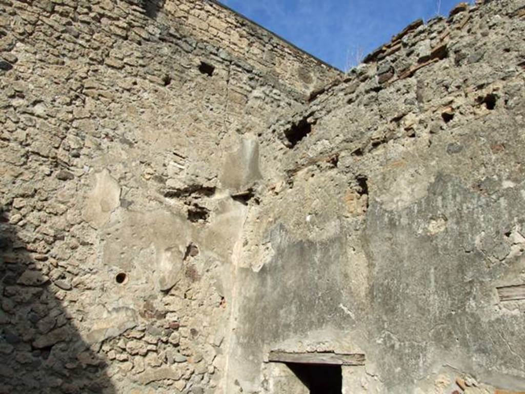 V.2.7 Pompeii. December 2007. North wall of garden area 12, and east wall above entrance to room 16.