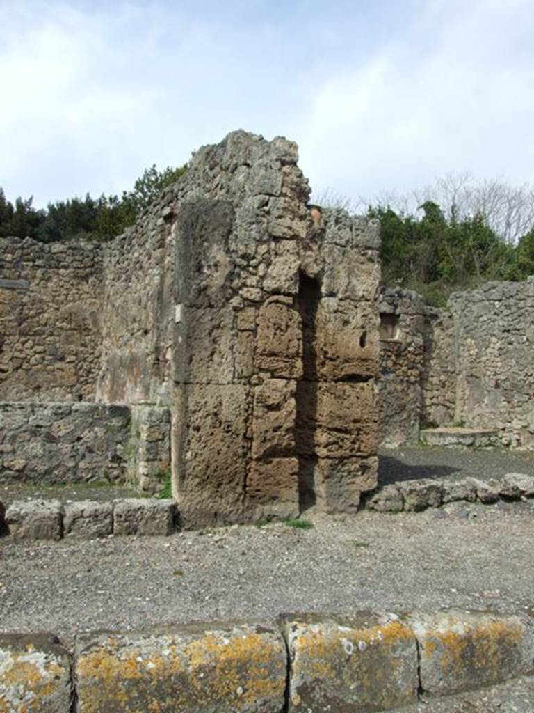 V.2.13 Pompeii,  March 2009.  Exterior wall between V.2.13 and V.2.14, with channel for downpipe.