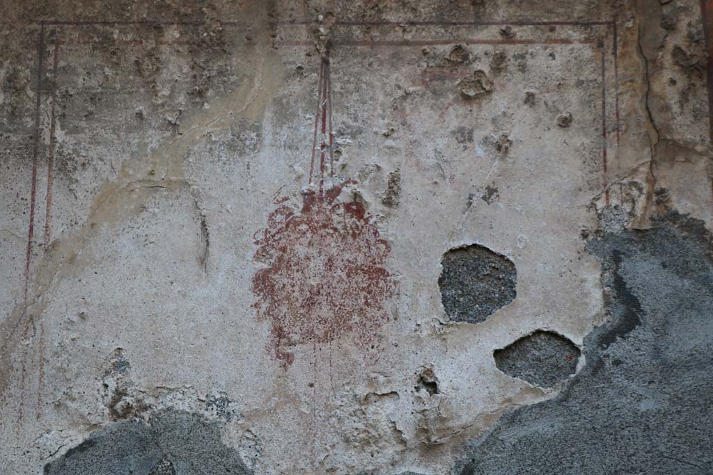 VI.7.9 Pompeii. December 2018. Detail of painted Gorgon from niche in west wall of south ala. Photo courtesy of Aude Durand.