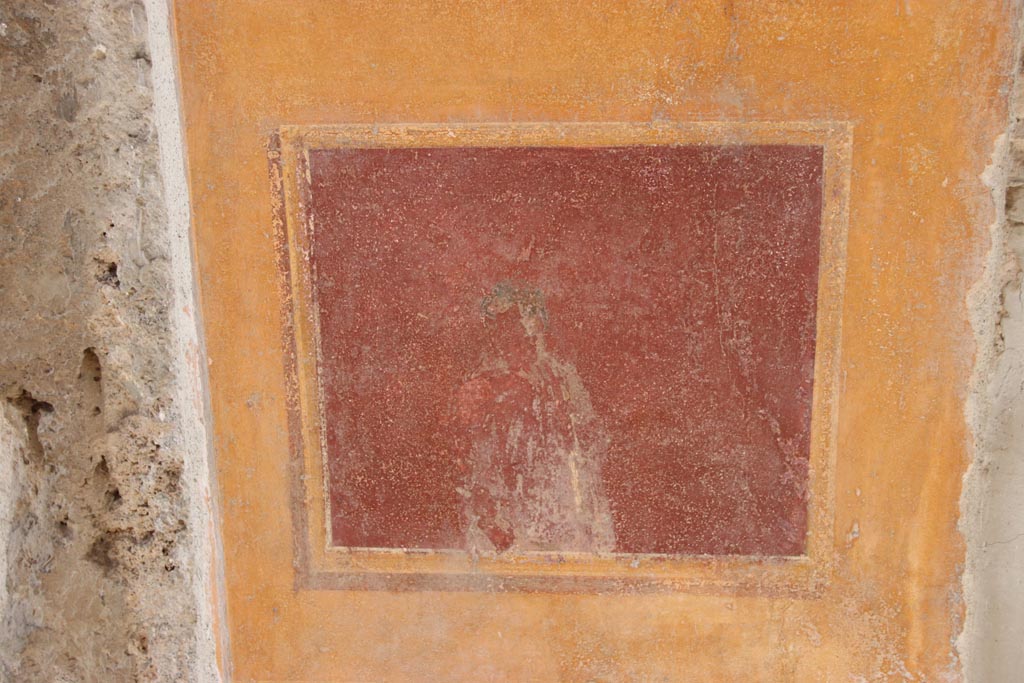 VI.15.1 Pompeii. October 2023. Painted panel on atrium wall between doorways. Photo courtesy of Klaus Heese.