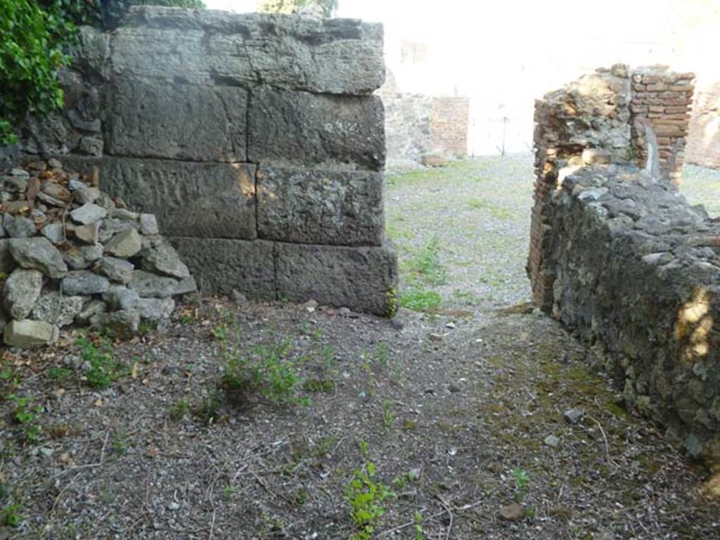 VI.17.1 Pompeii. May 2011. Looking east from room in north-west corner towards entrance doorway.
