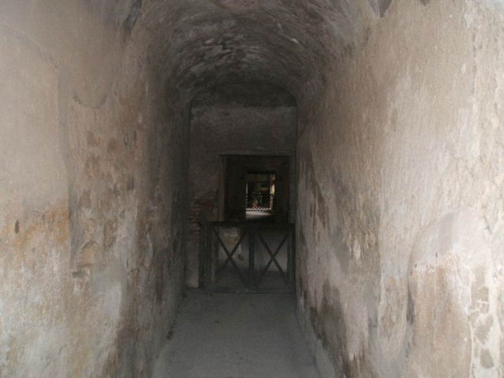 VII.5.2 Pompeii. May 2005. Looking south along corridor (16) into mens baths and changing room (14).
According to Fiorelli 
This corridor would have led directly into the changing room (apodyterium), consisting of a large room with seating on three sides (14).

