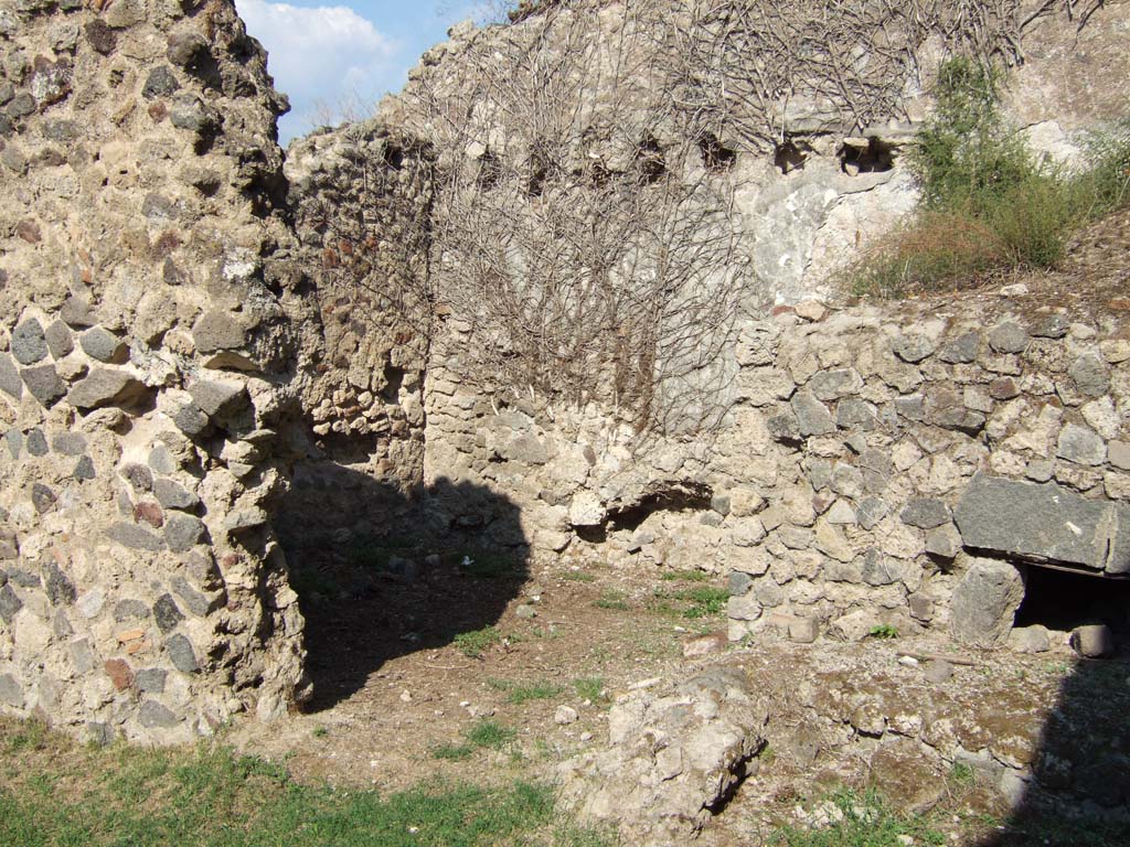 VII.12.7 Pompeii. September 2005. Looking east towards room at rear in north-east corner, near oven.