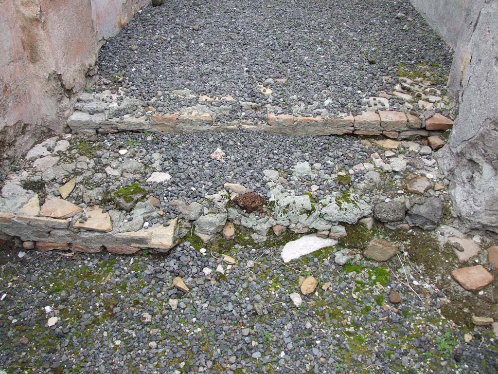 VII.14.5 Pompeii. March 2009. Remains of two steps from vestibule to fauces, or entrance corridor.