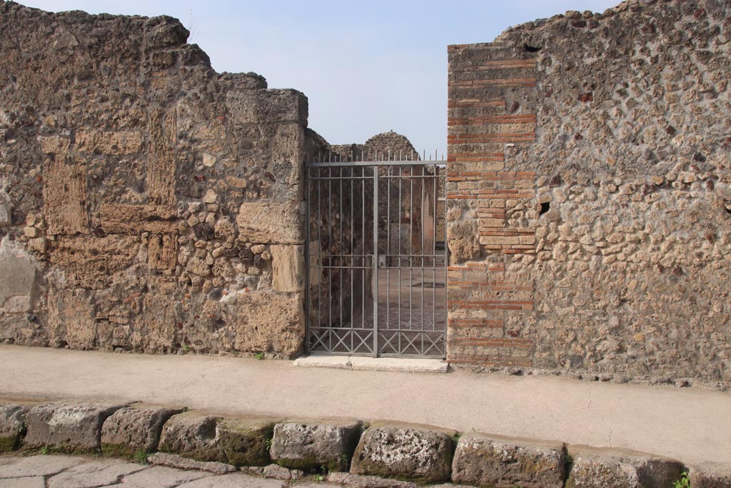 VIII.2.13 Pompeii. October 2023. Entrance doorway on west side of Via delle Scuole. Photo courtesy of Klaus Heese.