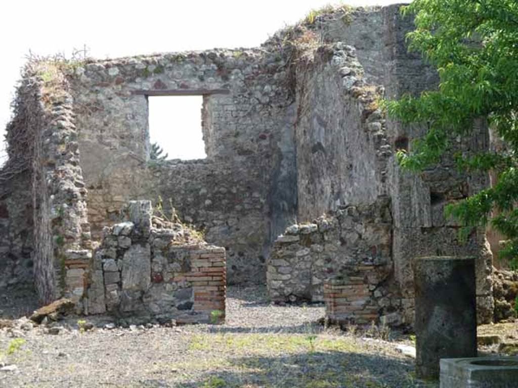 VIII.3.31 Pompeii. May 2010. Large exedra with window, on east side of the peristyle. Taken across the wall of VIII.3.29.
