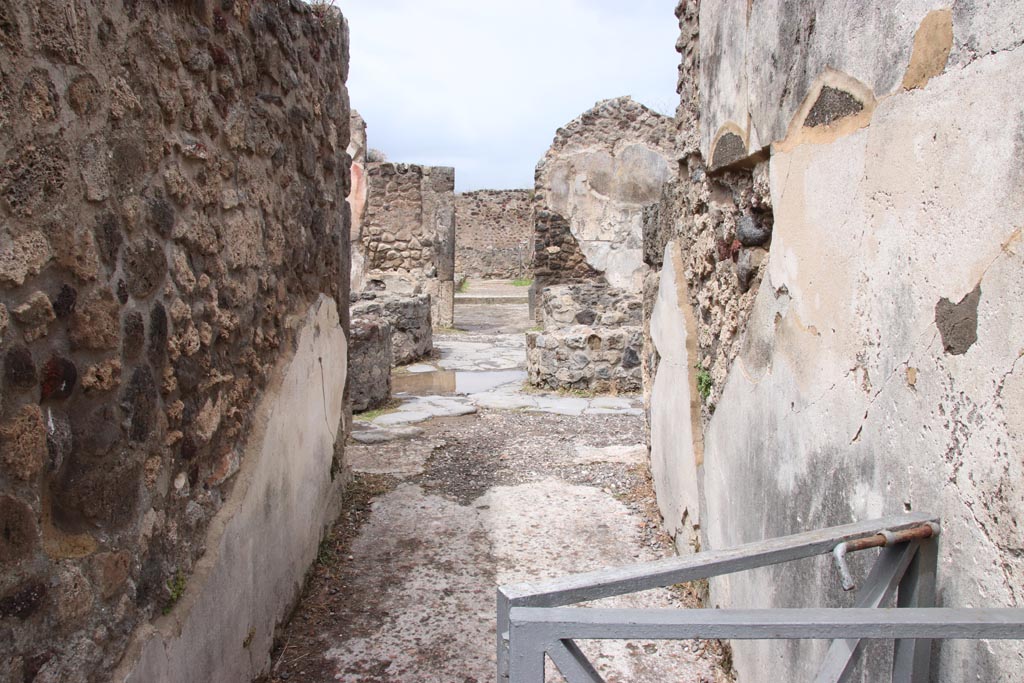 VIII.6.1 Pompeii. May 2024. Looking north along entrance corridor towards bakery. Photo courtesy of Klaus Heese.
