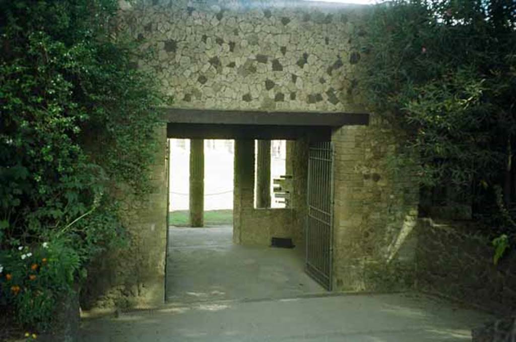 VIII.7.16 Pompeii. June 2010. Looking north to entrance through exterior south side of Gladiators Barracks. Photo courtesy of Rick Bauer.