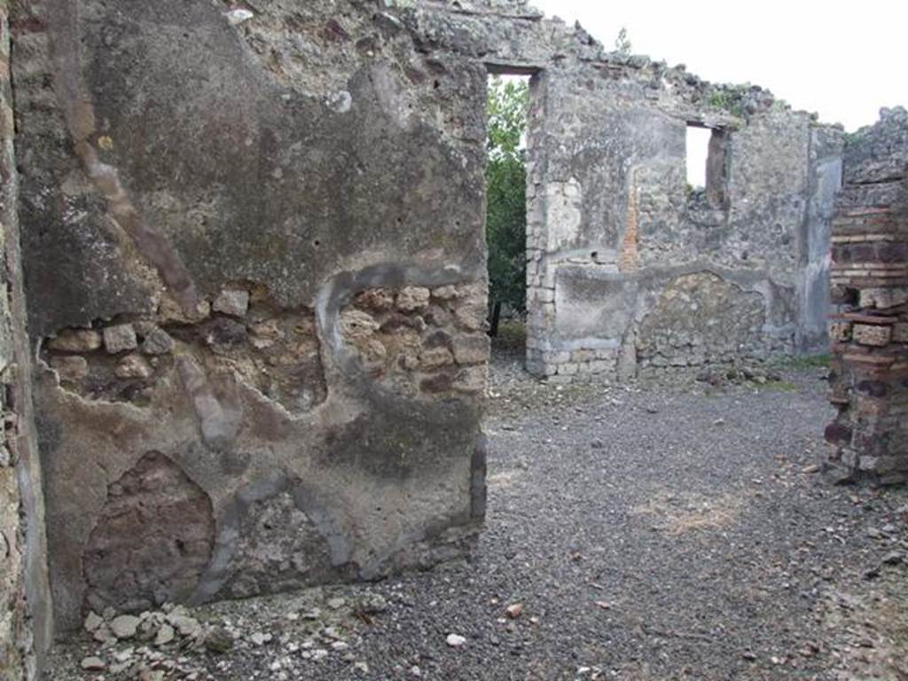 IX.2.21 Pompeii.   March 2009.  Room 5.  Triclinium. South wall and opening  to room 12, the north portico.