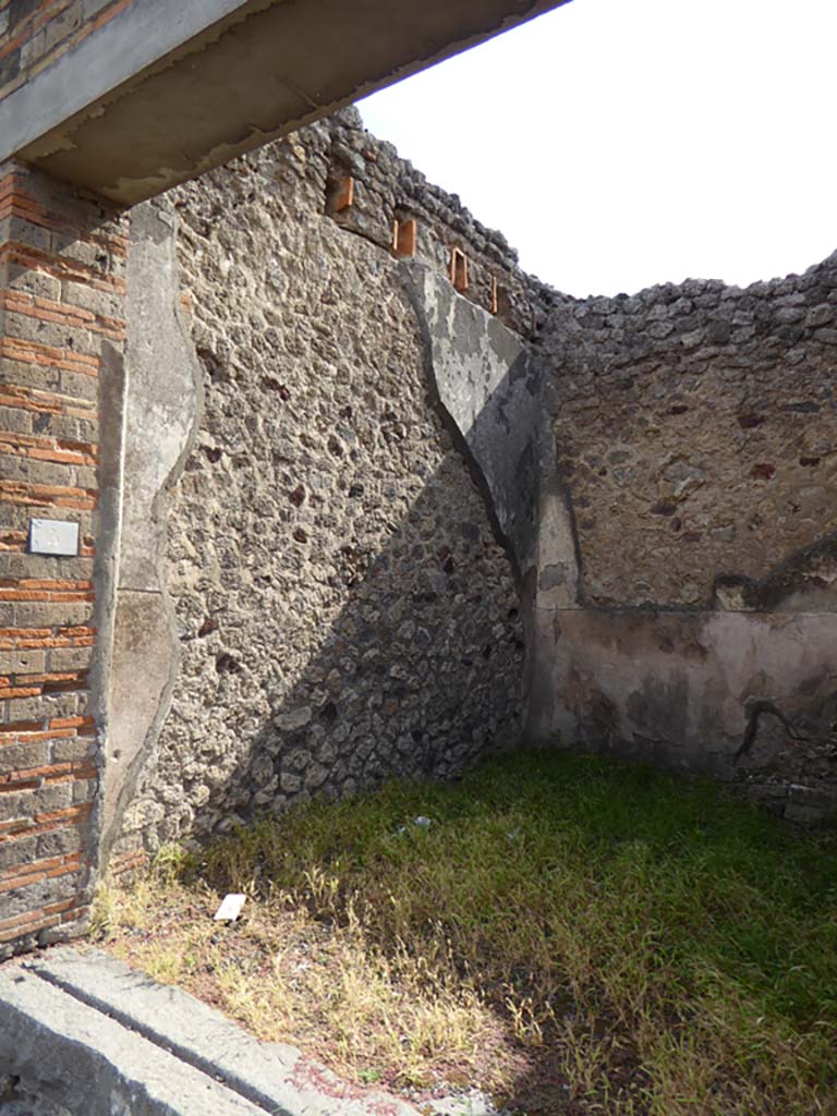 IX.5.5 Pompeii. December 2007. South wall of shop, with base of three steps to upper floor, in south-west corner.