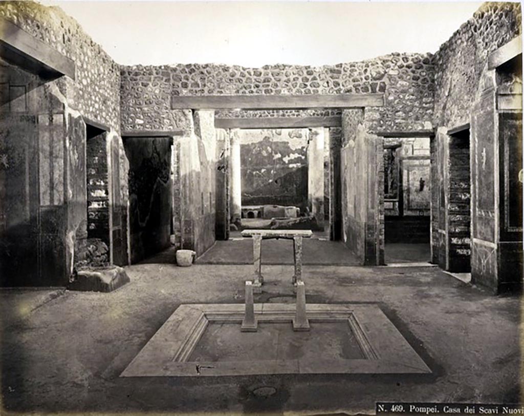 IX.5.11 Pompeii. Looking south across impluvium in atrium, towards tablinum.
Photograph No. 469, by Roberto Rive, (18..-1889) described as “Casa dei Scavi Nuovi”.  Public domain, via Wikimedia Commons
