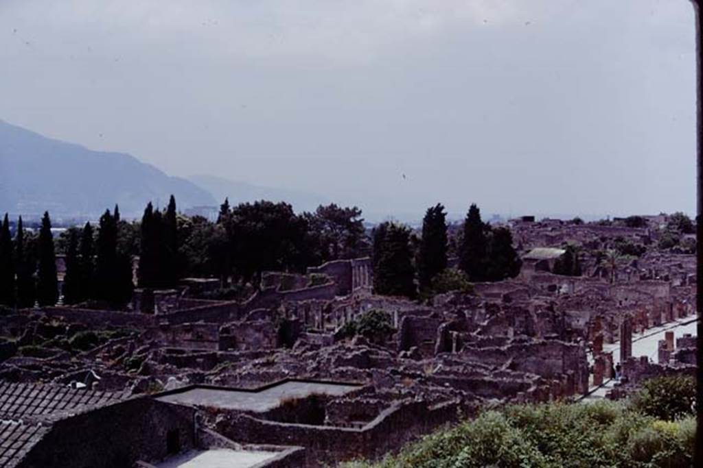 View looking south-west towards the Triangular Forum, centre, taken from above IX.7.12. Pompeii. 1973.    Photo by Stanley A. Jashemski.
Source: The Wilhelmina and Stanley A. Jashemski archive in the University of Maryland Library, Special Collections (See collection page) and made available under the Creative Commons Attribution-Non Commercial License v.4. See Licence and use details. J73f0234
