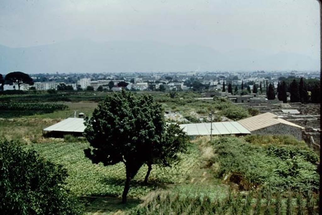 Looking east, Pompeii. 1973. View from the Casina dell’Aquila towards IX.13.1-3 (with roof). Photo by Stanley A. Jashemski. 
Source: The Wilhelmina and Stanley A. Jashemski archive in the University of Maryland Library, Special Collections (See collection page) and made available under the Creative Commons Attribution-Non Commercial License v.4. See Licence and use details. J73f0238
