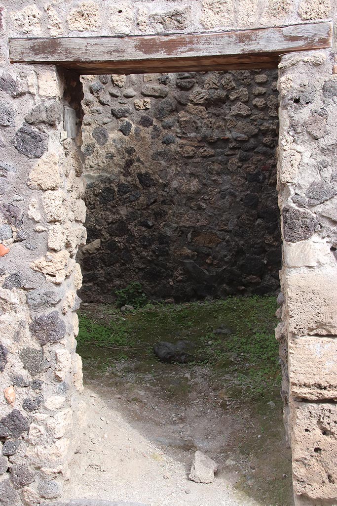 IX.7.15 Pompeii. October 2024. Looking east through entrance doorway. Photo courtesy of Klaus Heese.