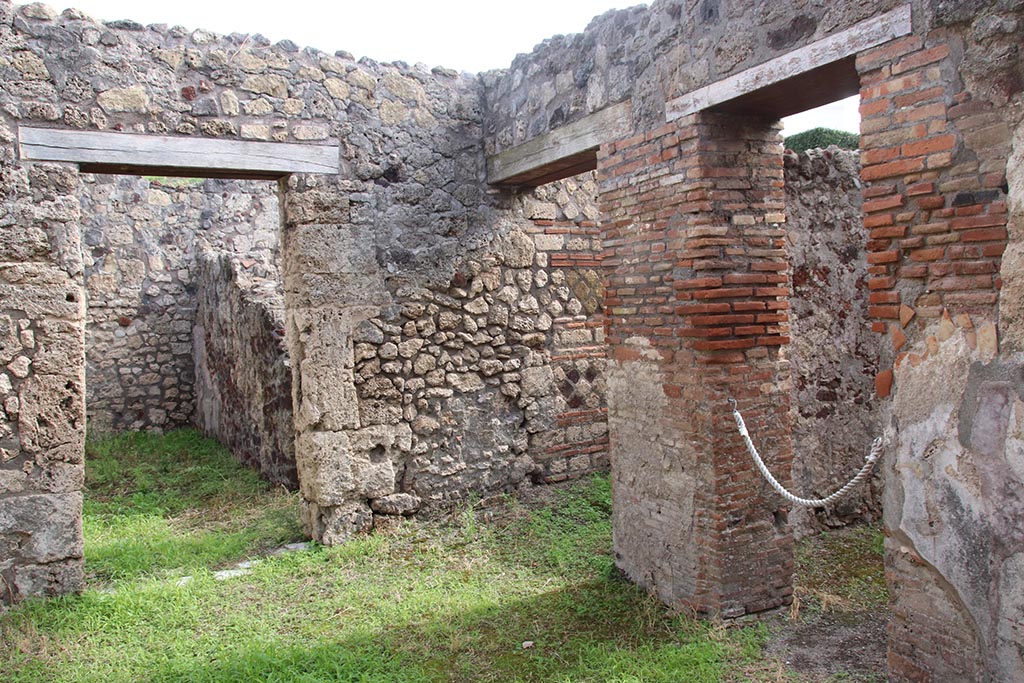 IX.7.19 Pompeii. October 2024. 
Looking east towards doorway to room g, on left, with corridor f, in centre, and doorway to room e, on right.
Photo courtesy of Klaus Heese.
